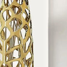 Close-up of the high-gloss gold glaze and organic coral-like openwork