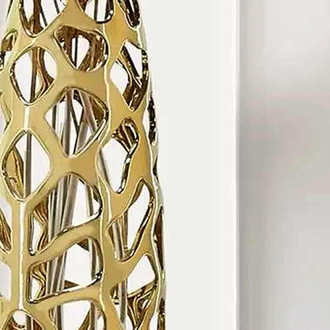 Close-up of the high-gloss gold glaze and organic coral-like openwork