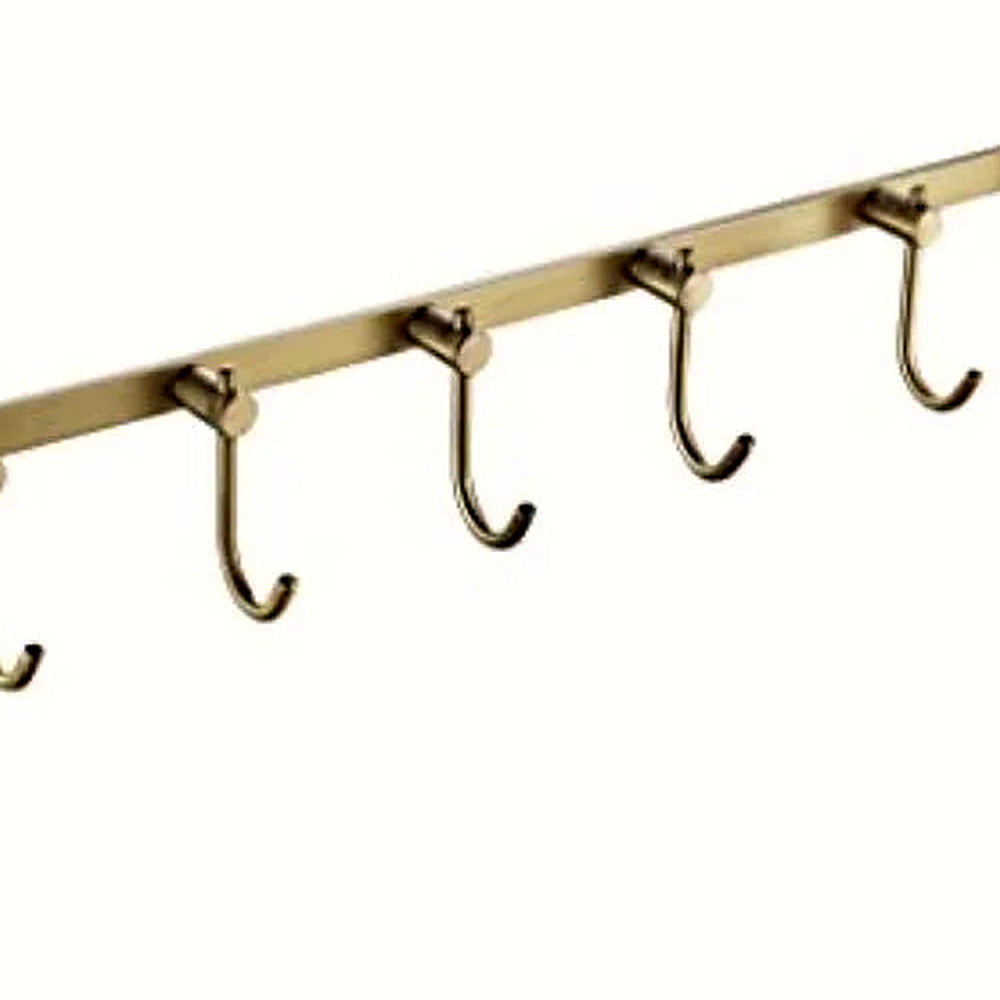 Close-up of the J-hooks and brushed brass bar