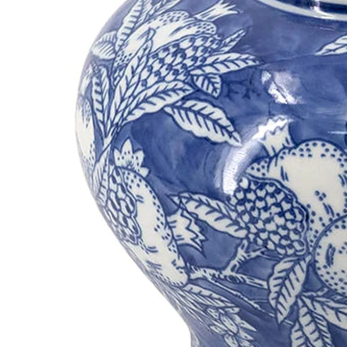 Detail of the jar's rounded shoulder, wrapped in cobalt blue botanical brushwork