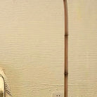 Detail of the natural bamboo stem nodes along the arched floor lamp