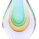 Detail of the amber base glow within the hand-blown glass form