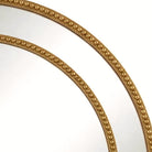 Detail of a gold strut joining the nested beaded frames