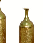 Detail of the satin gold necks and flared rims of the graduated vase set