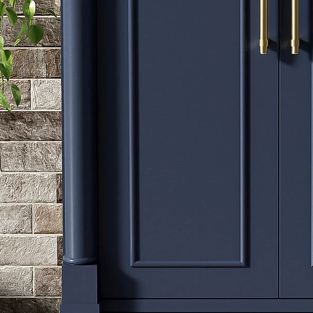 Detail of the satin gold bar pull and recessed panel door on the navy vanity