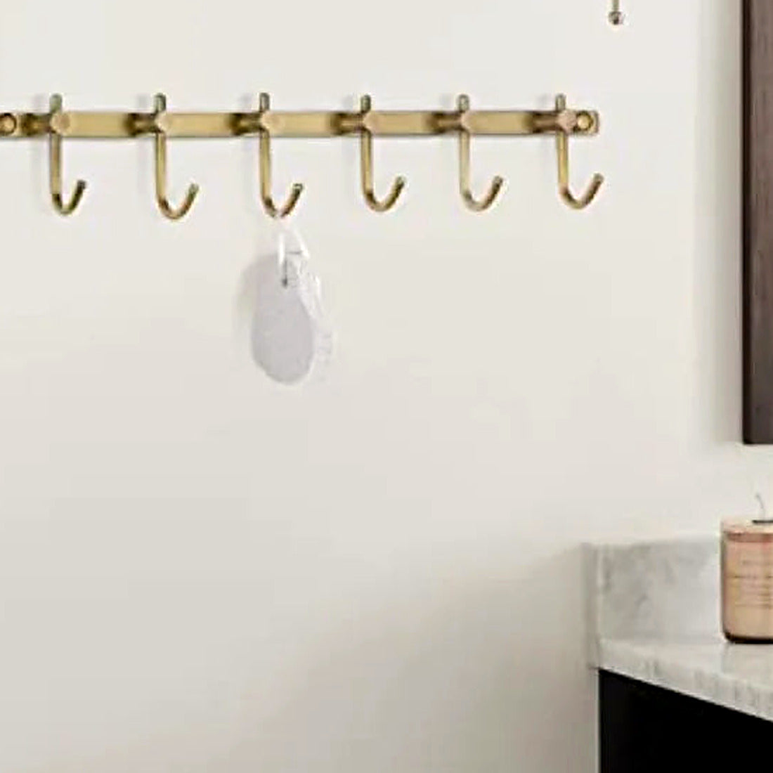 Detail of the brushed brass finish and wall mounts