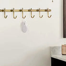 Detail of the brushed brass finish and wall mounts