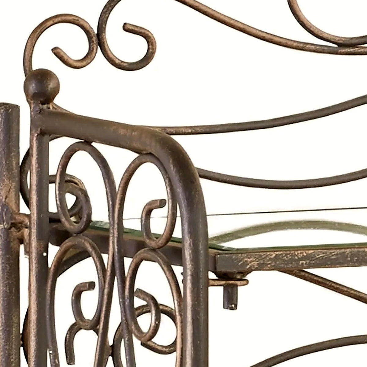 Close-up of the side scrollwork and clear glass shelf in antique bronze with gold highlights