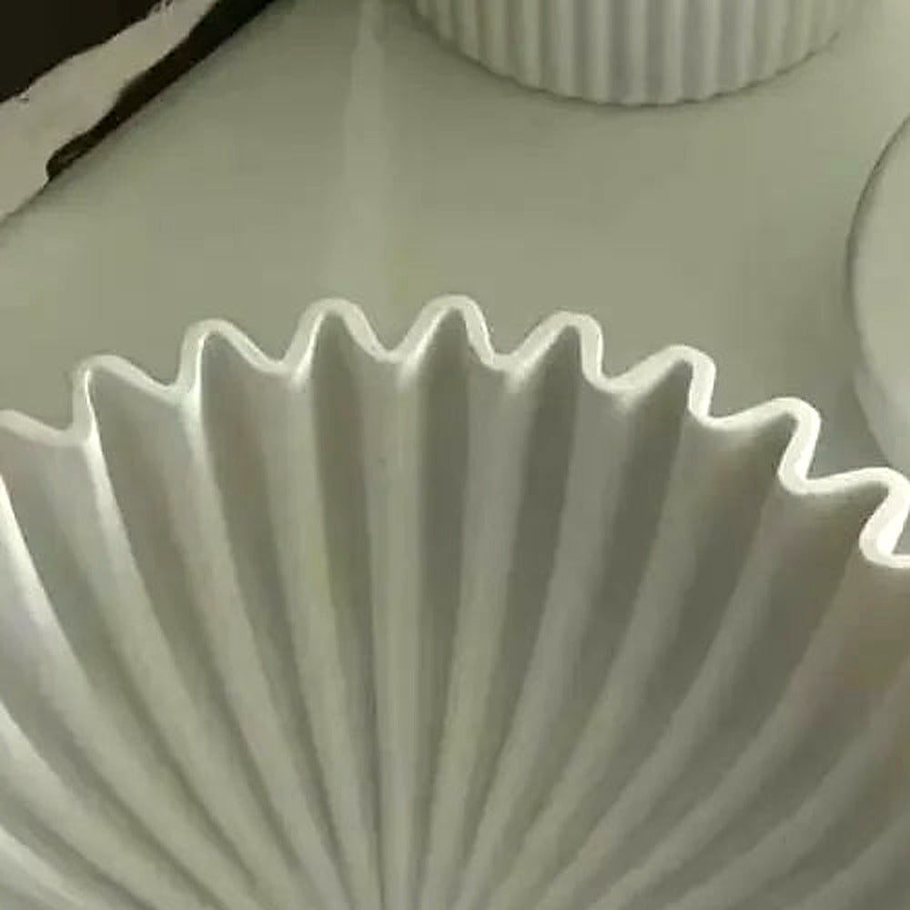 Close-up of the matte white pleated ceramic texture