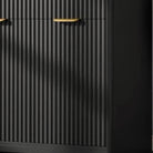 Close-up of the reeded black fluting texture wrapping the vanity front