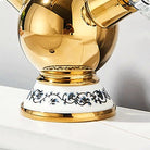 Close-up of the blue-and-white porcelain collar and polished gold spherical body