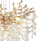 Close-up of almond-shaped faceted crystals and gold branch tips on the right side of the chandelier