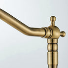 Close-up of the gooseneck spout tip and aerator in carved antique brass