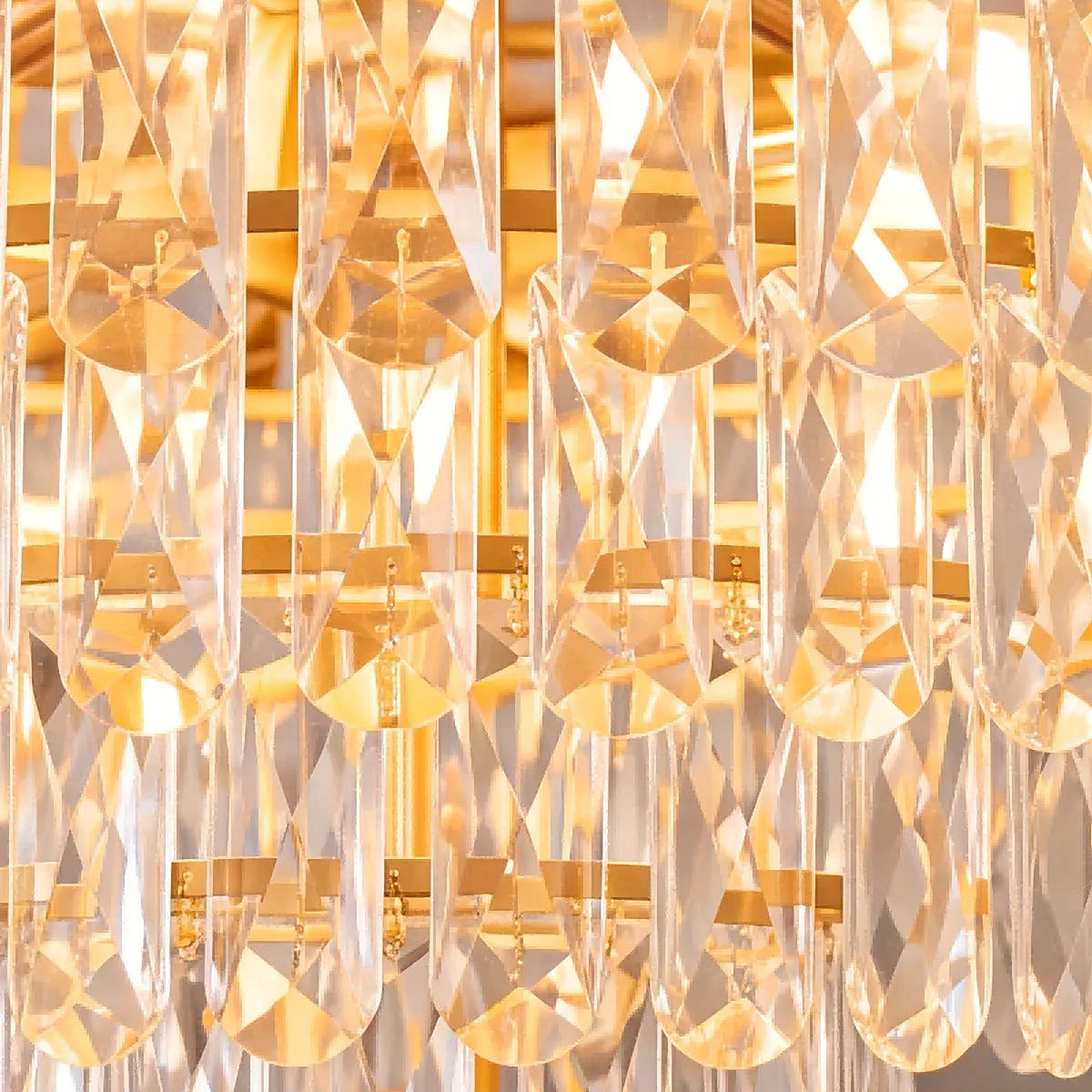 Close-up of faceted raindrop crystal tips catching warm light