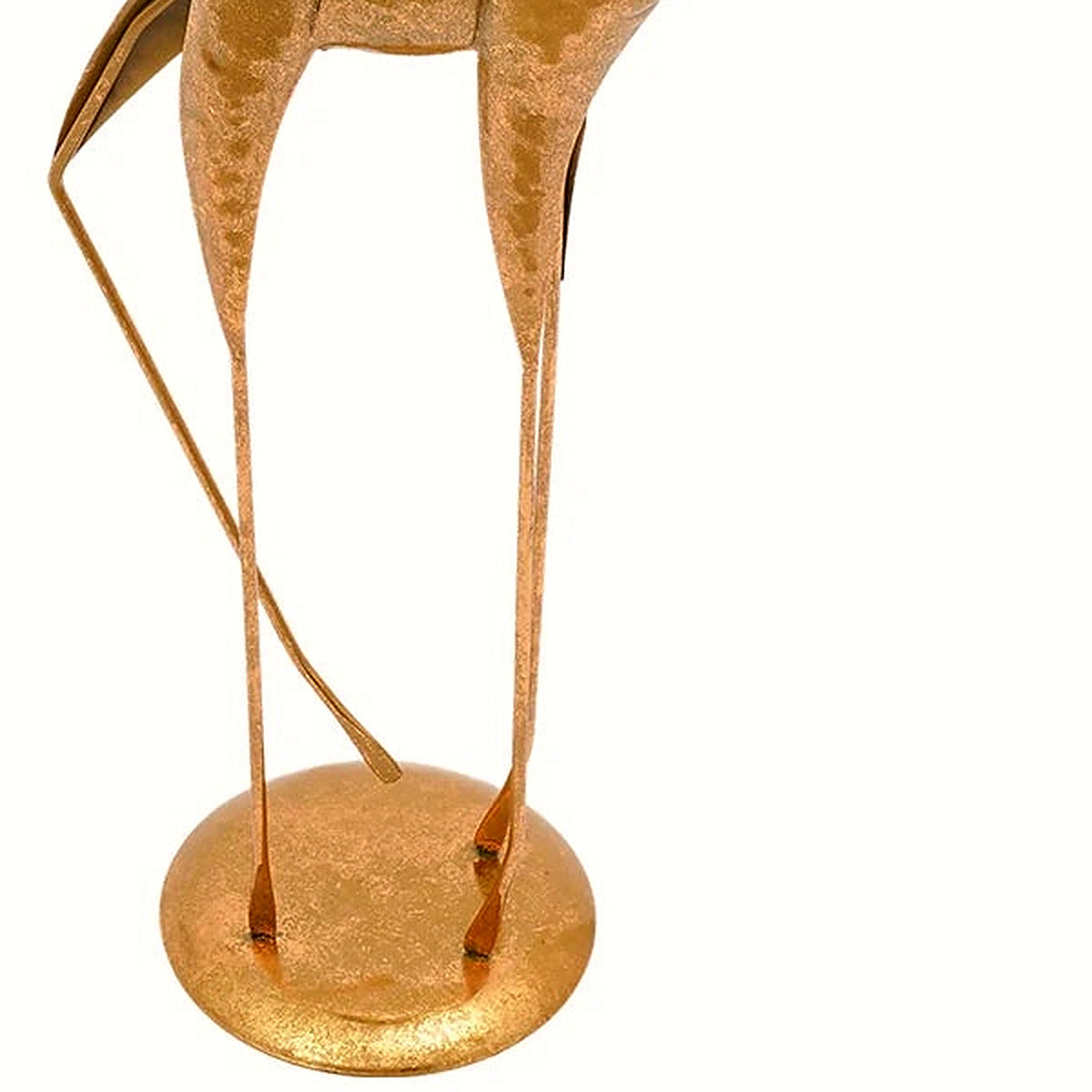 Close-up of the slender gold metal body and legs of the deer sculpture