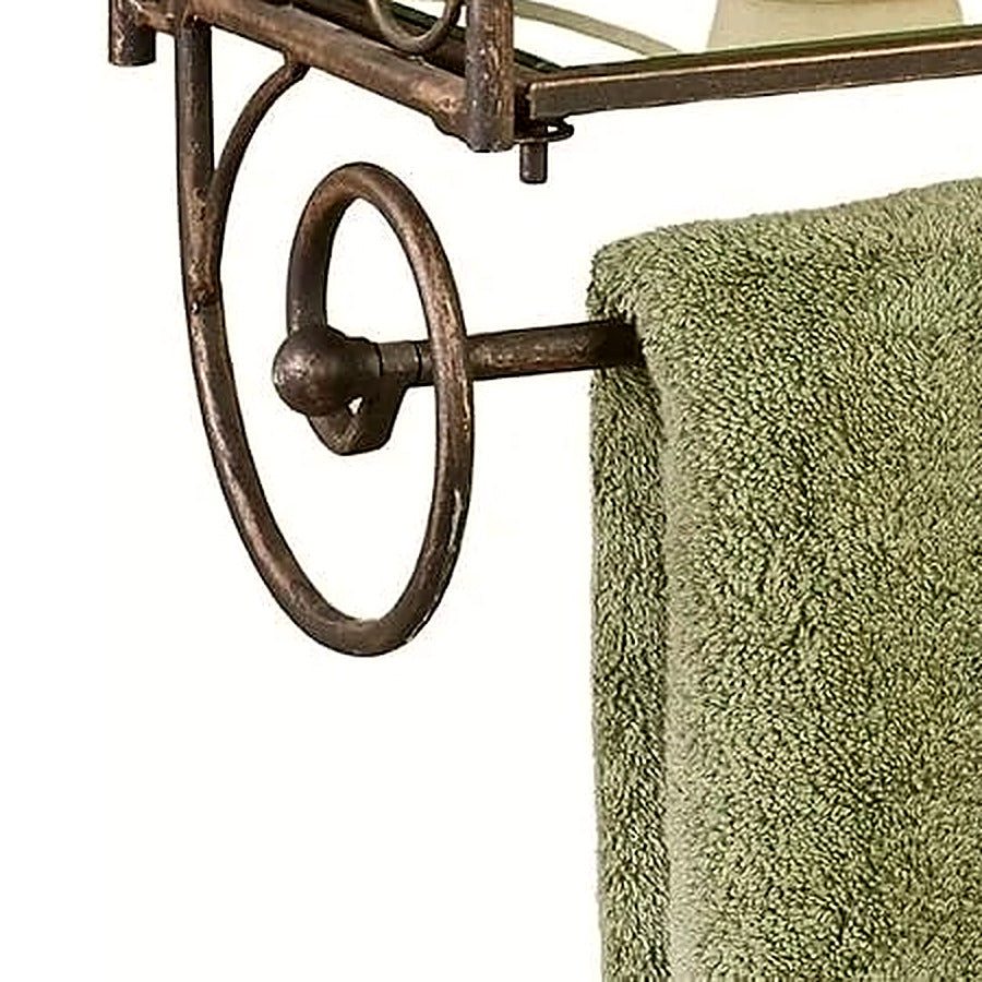 Detail of the antique bronze towel bar with gold highlights beneath the lowest glass shelf