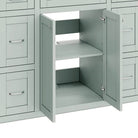 Close-up of the open mint green cabinet interior and shelf