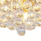 Close-up of the clustered faceted crystal spheres at the base of the fixture