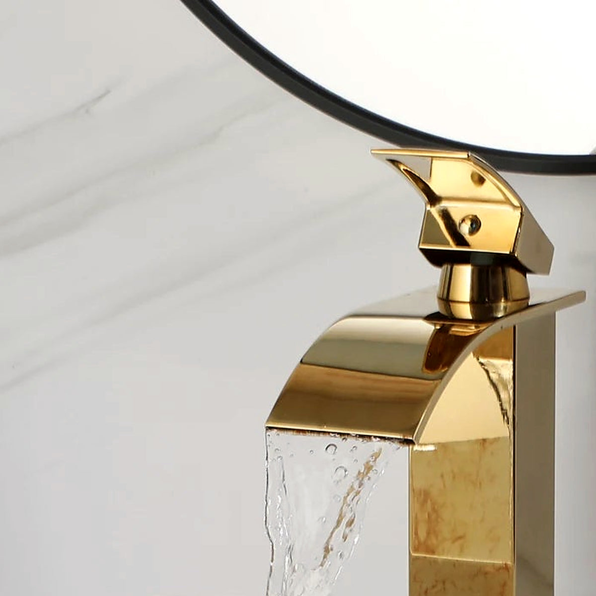 Close-up of the polished gold faucet spout included with the marble-look vessel sink