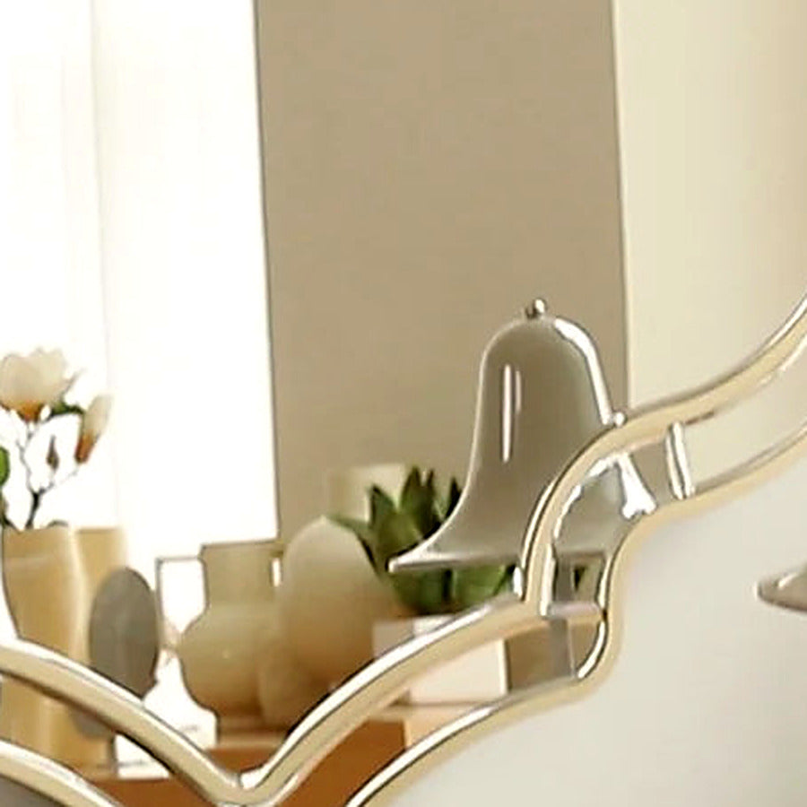 Close-up of the gold frame edge meeting the mirrored surface