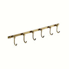 Brushed brass six-hook towel rail, 16 in, on a clean white backdrop