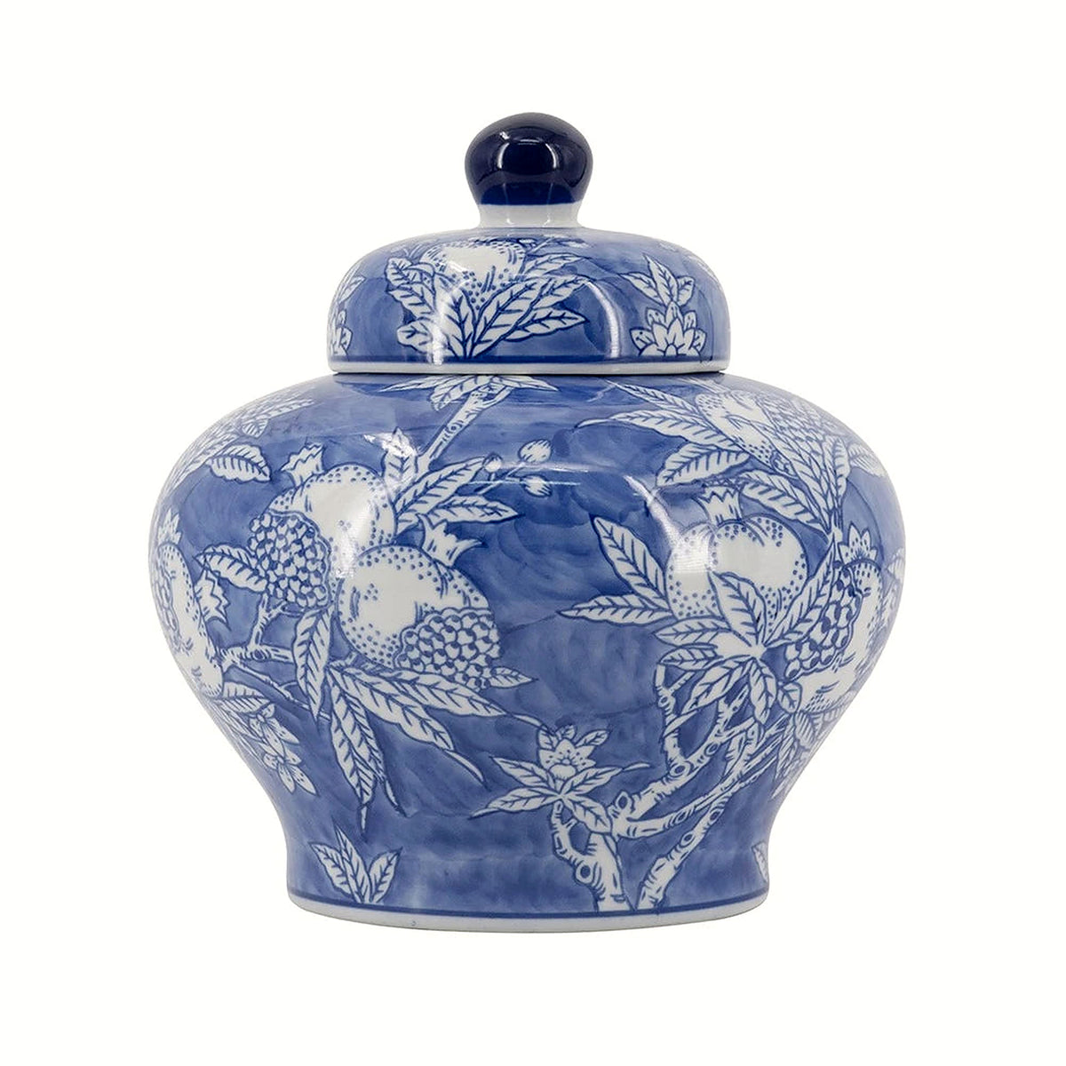 Front view of the blue and white porcelain ginger jar, its domed lid crowned with a deep-cobalt finial