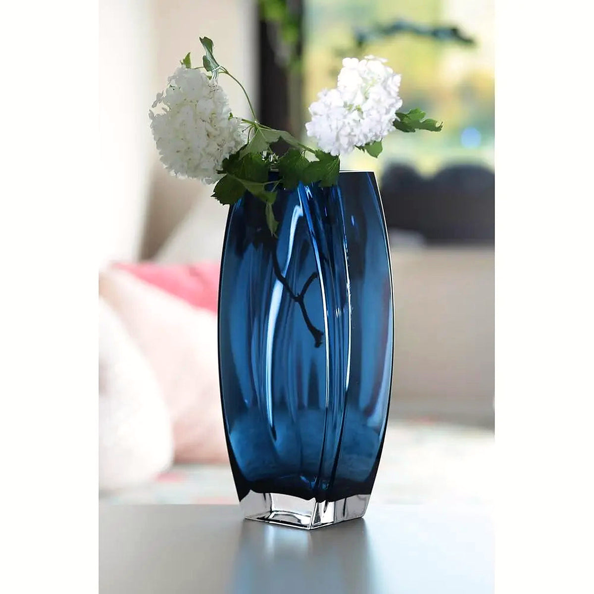 Heavy blue-teal art glass vase, 10.25 in, with white blooms on a bright table (flowers and décor shown for styling)