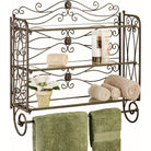Antique bronze three-tier scrollwork bath shelf with towel bar and glass shelves, with gold highlights