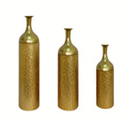 Gold leaf-pattern metal floor vases, set of three graduated sizes, on a clean white backdrop