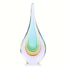 Hand-blown glass teardrop sculpture, 9 in, with teal-to-amber core on a clean white backdrop