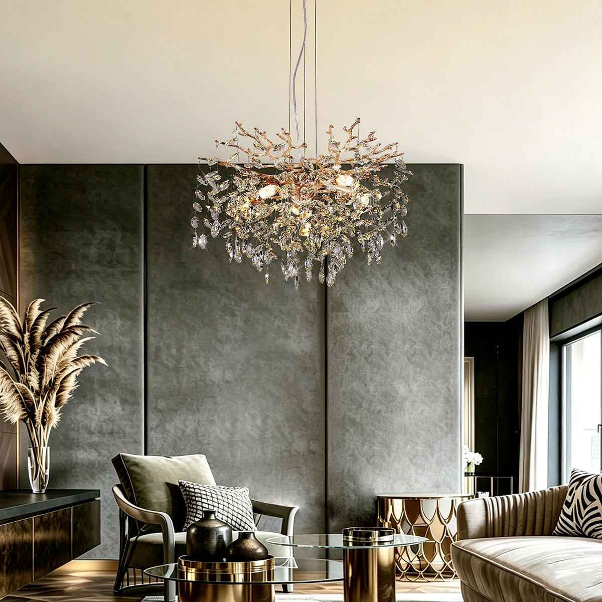 Gold crystal branch chandelier glowing above a modern living room seating area (furniture and décor shown for styling)