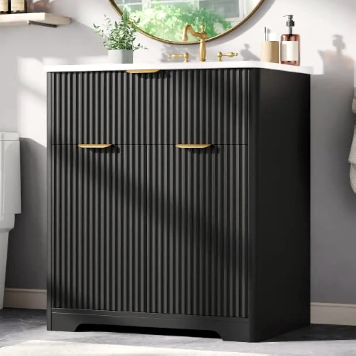 Black fluted vanity at a three-quarter angle showing the vertical reeded texture (faucet shown for styling)