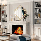 Gold quatrefoil wall mirror above a marble fireplace (fireplace and décor shown for styling)