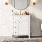 White 24 in vanity with gold knobs in a bathroom setting (faucet and mirror shown for styling)