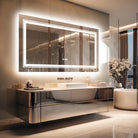 Backlit LED anti-fog bathroom mirror above a floating vanity in a modern bathroom
