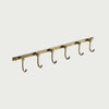 Slow cinematic tour of the brushed brass six-hook towel rail from real product photography