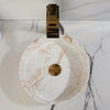 Slow cinematic tour of the white marble-look ceramic vessel sink with gold faucet from real product photography