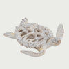 Slow cinematic tour of the white coral-pattern sea turtle sculpture from real product photography