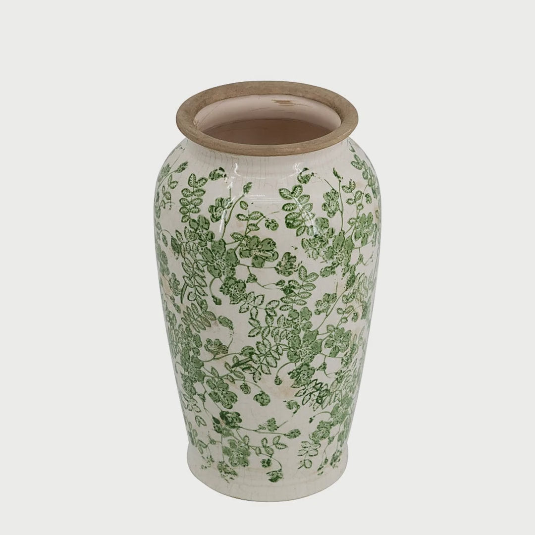Slow cinematic tour of the white and green floral ceramic vase from real product photography