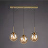 Glass Globe Kitchen Island Pendant Light in Amber, Smoky or Clear video showcase