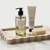 Slow cinematic tour of the scalloped natural travertine vanity tray from real product photography
