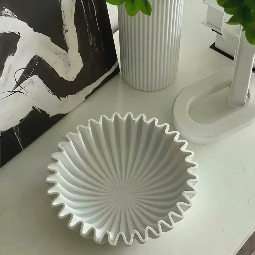 Slow cinematic tour of the white pleated ceramic centerpiece bowl from real product photography