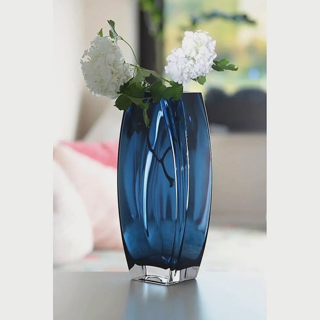 Slow cinematic tour of the heavy blue-teal art glass vase from real product photography