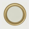 Slow cinematic tour of the brushed gold round wall mirror from real product photography